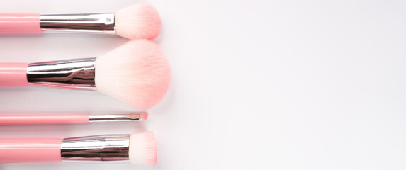 Poster - A set of makeup brushes on a white background