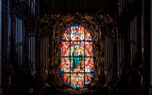 Virgin Mary In The Stained Glass Window And An Old Musical Organ