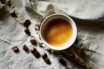 Wall Mural - Cup of espresso coffee on linen cloth. Top view. Copy space