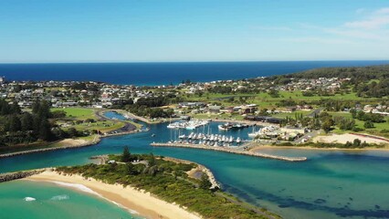 Sticker - Sandy beach on Bermagui town waterfront in aerial flying to Harbour as 4k.
