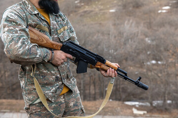 soldier holding hand gun