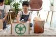© FAMILY STOCK - Asian Little girl is separate trash to recycle