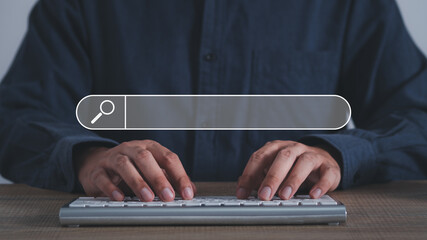 Wall Mural - man's hands are using a computer keyboard to searching for information. using search console with yo