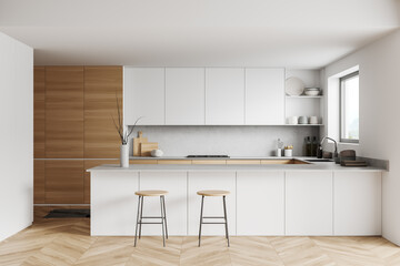 light kitchen interior with island and seats, shelves and kitchenware, window