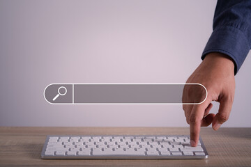 Wall Mural - man's hands are using a computer keyboard to searching for information. using search console with yo