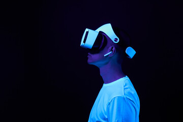 Wall Mural - man interting with virtual reality using vr headset.