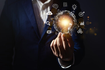 businessman hand holding light bulb for innovation and creative idea concept.