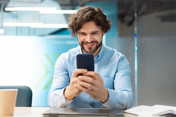 Sticker - Portrait of businessman using smartphone at office