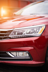 Close up detail on one of the red car taillight modern red crossover car. Exterior detail business automobile.