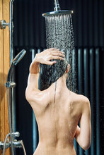 A Young Girl Bathed In A Shower By Using Figure