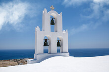 Bell Tower Of The Traditional Greek Tower On Blue Sea Background.