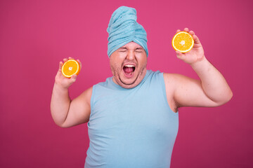 Sports and healthy lifestyle. Funny fat man on a pink background. Retro style.