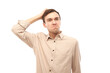 © amixstudio - Smart brunette man in casual touches head thinks doubts, makes decision isolated on blue studio background