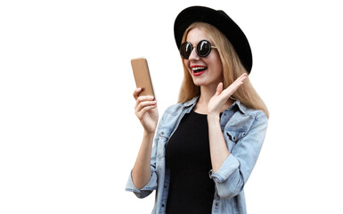 Wall Mural - Portrait of surprised young woman with phone on city street wearing a black round hat isolated on white background