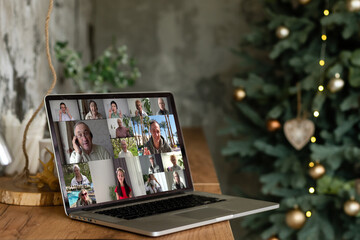 Virtual Christmas tree meeting team teleworking. Family video call remote conference. Laptop webcam screen view. Team meet working from their home offices. party online