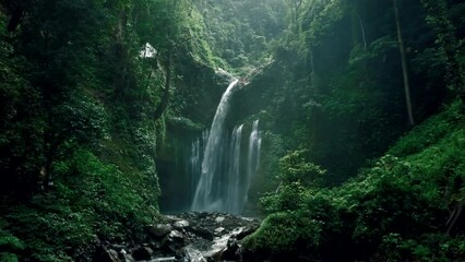 dreamy waterfall in deep jungle of lombok
