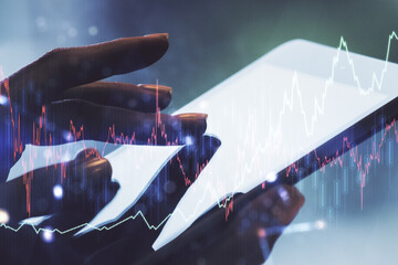 Double exposure of abstract creative financial diagram with finger clicks on a digital tablet on background, banking and accounting concept