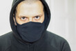 © kyllian - Man with hood and mask. All black