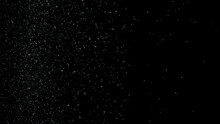 White Dust Debris Exploading On Black Background, Motion Powder Spray Burst In Dark Texture. Stock Footage. Beautiful Small Particles Splashing And Falling Down.
