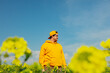 © Masson - ukrainian man in rapeseed field in spring time