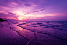 Nature In Twilight Period Which Including Of Sunrise Over The Sea And The Nice Beach. Summer Beach With Blue Water And Purple Sky At The Sunset.