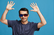 © SHOTPRIME STUDIO - handsome man Cheerful man in cinema glasses in a t-shirt isolated background