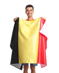 Wall Mural - Young man with flag of Belgium on white background