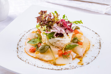 Wall Mural - Salad with crab and scallop on a white plate