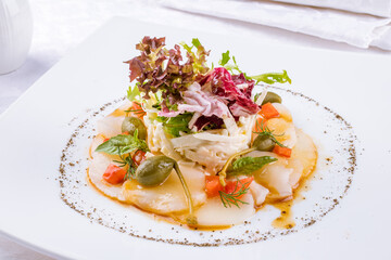 Sticker - Salad with crab and scallop on a white plate