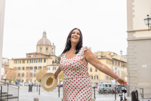 Happy Curvy Woman Wearing Polka Dot Dress Enjoying In City