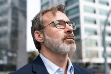 Mature Businessman With Eyeglasses Looking Up