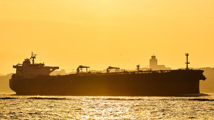 Wall Mural - An old bulk carrier or bulker sails in the sea to trade around the world