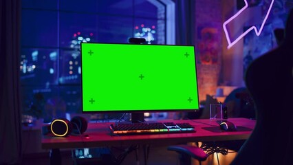 Fototapete - Gaming at Home: Empty Gaming Station with Player's Personal Computer with Green Screen Chroma Key Display Standing on a Wooden Desk in Stylish Loft Apartment with Neon Lights. Zoom In Shot.