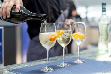 Waiter serving champagne in a glass