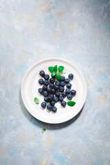 Wall Mural - Overhead view of blueberry on plate