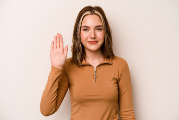 Young caucasian woman isolated on white background smiling cheerful showing number five with fingers.