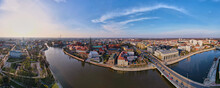 Aerial Panorama Of Wroclaw City With Car Bridge Over Odra River In Poland, Urban Cityscape With Historical European Architecture