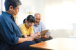 © bennnn - Smiling Asian grandparents on couch with granddaughter looking at tablet. happy three generation family spending time together at home.