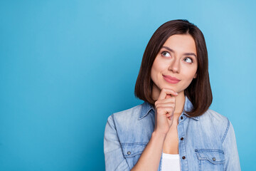 Wall Mural - Photo of pretty dreamy lady dressed denim shirt hand chin looking empty space isolated blue color background