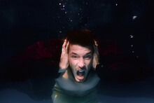 An Underwater Shot Of A Man Screaming In A Swimming Pool On Black Background