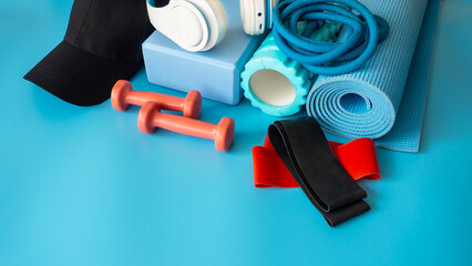 Sports equipment for fitness. Fitness and healthy lifestyle. Blue background.