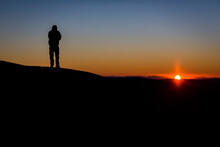Silhouette Of A Hiker At Sunrise