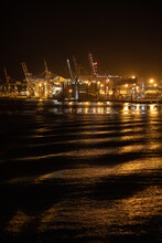 The Industrial Lighting Emitted From The Port Of Brisbane Operating At Night.