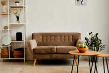 Background Image Of Minimal Living Room Interior With Velvet Couch And Green Apples Bowl On Wooden Table , Copy Space
