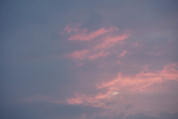 Wall Mural - Red, blue and orange colors in the sky at late evening with lots of clouds