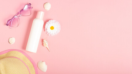 children's sunscreen, sunglasses accessories and jewelry on a pink background. cosmetics and accesso
