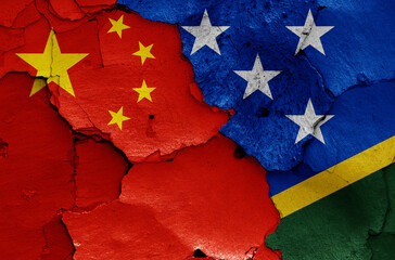 Wall Mural - flags of China and Solomon Islands painted on cracked wall