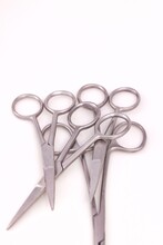 Bunch Of Surgical Scissors On A White Background ,shallow Depth Of Field Image.