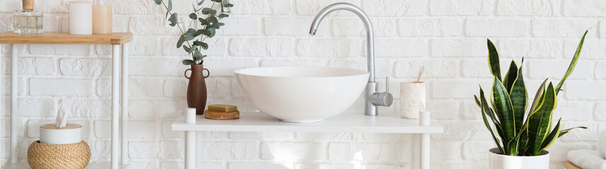 Poster - Beautiful interior of modern bathroom with sink near white brick wall