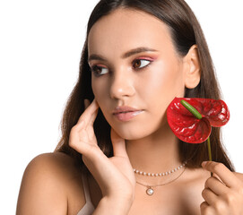 Wall Mural - Beautiful woman with hand near face holding anthurium flower on white background